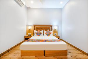 a bedroom with a large bed in a room at ZARA GRAND HOTEL in Mumbai