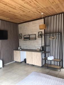 a desk in a room with a wooden ceiling at Relax villa Poduzska in Sinyak