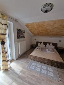 a bedroom with a large bed and a large window at Haus Emily in Schladming