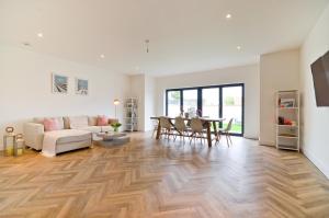 a living room with a couch and a table at 'Seafarers' Bellevue, Ryde, Isle of Wight in Ryde