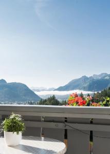 a balcony with a view of the mountains at Wildgrün Maxi Lodge 7 in Pfronten