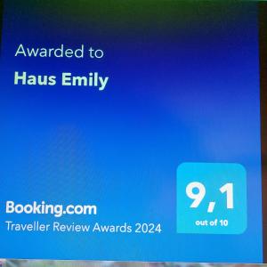 a blue sign that says awarded to haus entity at Haus Emily in Schladming