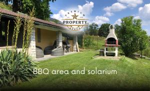 a bbq area and aquarium sign in a yard at THE LOFT with private parking, BBQ area, near COMO lake I Villa dei Leoni in Morbio Inferiore
