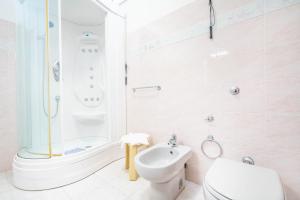 a bathroom with a shower and a toilet and a sink at Al Bastione in Cagliari