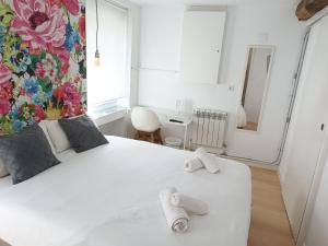 Łóżko lub łóżka w pokoju w obiekcie Rin Rooms