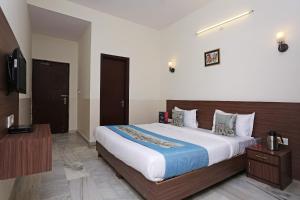 Hotel Maan's Heritage tesisinde bir odada yatak veya yataklar