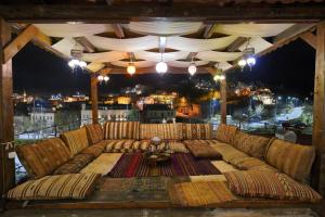 a large couch sitting on top of a balcony at Alaturca House in Göreme