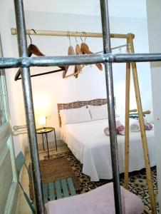 a bedroom with a bed in a room at Alojamientos con encanto en casa de patio in Córdoba