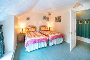 a bedroom with a bed in a room at Lower Cottage Newcastle Emlyn in Cwm-pengraig