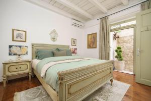 a bedroom with a large bed and a window at The Stone House in Zaton