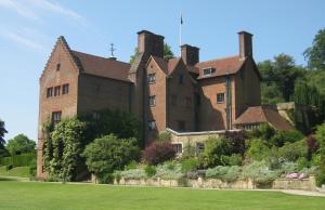 a large brick building with a yard in front of it at Finest Retreats - Bracken in Dormans Land