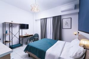 Posteľ alebo postele v izbe v ubytovaní Alcyone Studios and Apartments