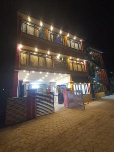 a building at night with lights on it at SD Residency - Yercaud in Yercaud