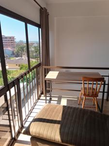 a room with a balcony with a table and a chair at Loft Las Piedras in Torres