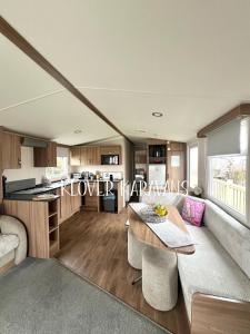 a living room with a couch and a table at Seton Sands Holiday Village Klover in Port Seton