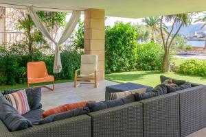 a couch and two chairs on a patio at Tarida in Alcudia