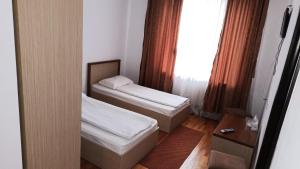 Postel nebo postele na pokoji v ubytování Hotel Posada