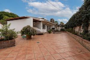 a patio in front of a house at Charming two bedroom house close to the sea in Marbella