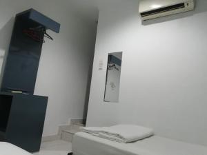 Postel nebo postele na pokoji v ubytování Hotel Global Sungai Way