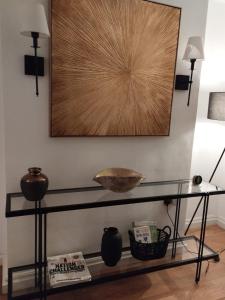 a glass shelf with a bowl on a wall at Knightsbridge Emerald in London