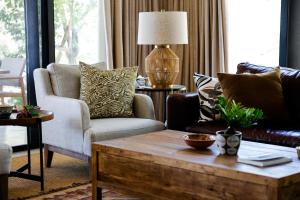 a living room with a couch and a coffee table at Summerplace Game Reserve in Vaalwater