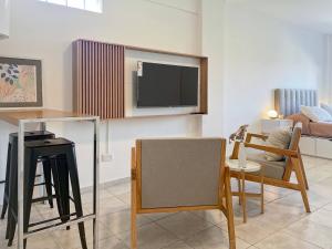A television and/or entertainment centre at Charming Nordic Studio in Villa Pueyrredon Your Home in Buenos Aires
