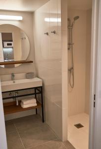 a bathroom with a shower and a sink at Pure Thermal Residence in Roquebillière