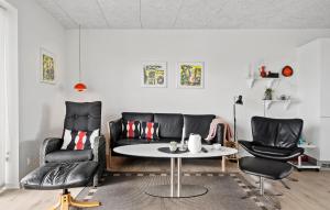a living room with a couch and two chairs and a table at Cozy Apartment In Ringkøbing With Wifi in Ringkøbing