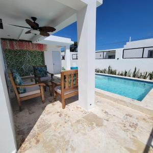 a villa with a swimming pool and a patio at TropicalvacationvillaEYS in Punta Cana