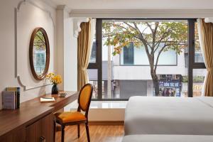 Postel nebo postele na pokoji v ubytování Eliana Premio Hotel Hanoi + 37 fotografií