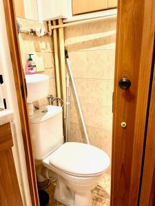 a small bathroom with a toilet and a sink at Bratislava City Center in Nivy +20 photos