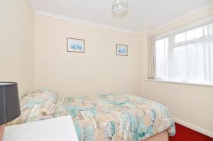 A bed or beds in a room at 162 Sandown Bay Holiday Park
