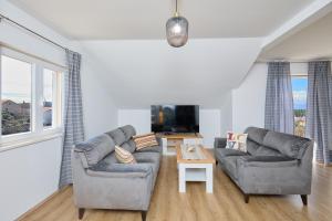Телевизор и/или развлекательный центр в Apartment 2Home