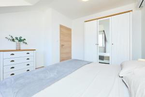 Кровать или кровати в номере Apartment 2Home