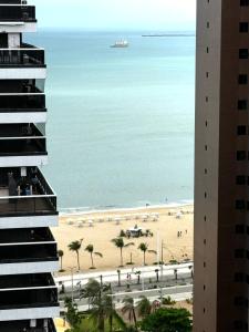 a view of the beach from a building at Deluxe Rooms By Booking Fortaleza in Fortaleza