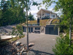a house with a grass roof on top of it at Holiday Home Vapunkärki by Interhome in Orivesi