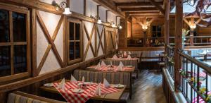 a restaurant with tables with red and white napkins at Hotel Enziana Wien in Vienna