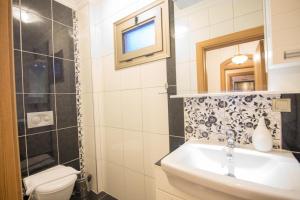 a bathroom with a sink and a toilet at Mete 2 Villa İcmeler Marmaris in İçmeler +10 photos