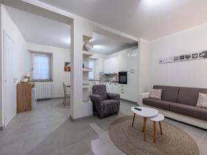 a living room with a couch and a table at Holiday Home Louna by Interhome in Mergozzo