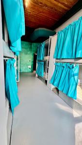 a row of blue seats in a room with at Iconic Athens Hostel in Athens