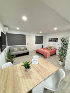 a living room with a bed and a table at Calma & Mar in Arona