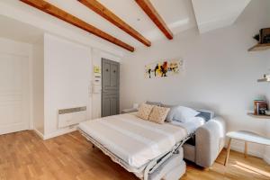 Postel nebo postele na pokoji v ubytování Ô Merveilleux Compans - Centre ville Toulouse - Wifi, TV