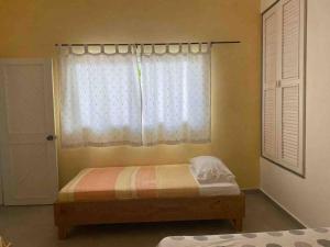 Ein Bett oder Betten in einem Zimmer der Unterkunft Villa Águila