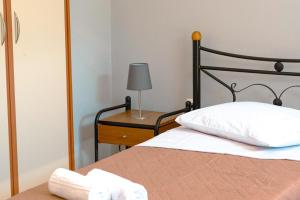 Postel nebo postele na pokoji v ubytování Olia Apartments S