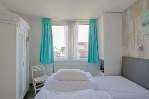 Postel nebo postele na pokoji v ubytování Appartement Seinpost 26 - Callantsoog aan Zee