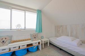 Postel nebo postele na pokoji v ubytování Appartement Seinpost 26 - Callantsoog aan Zee