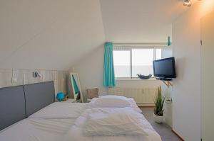 Postel nebo postele na pokoji v ubytování Appartement Seinpost 26 - Callantsoog aan Zee
