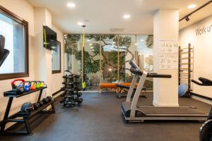 a gym with treadmills and a treadmill at Leonardo Hotel San Sebastián in Donostia-San Sebastián
