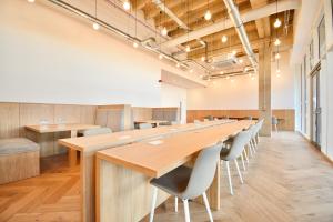 a large conference room with a long table and chairs at Station House Apartments in Milton Keynes