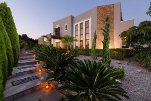 a house with lights in front of it at Vento Imperiale Estate in Rhodes Town